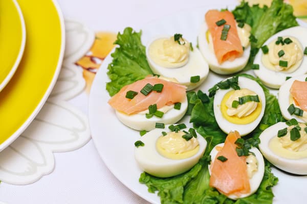 Deviled eggs with salmon on an Easter-themed table